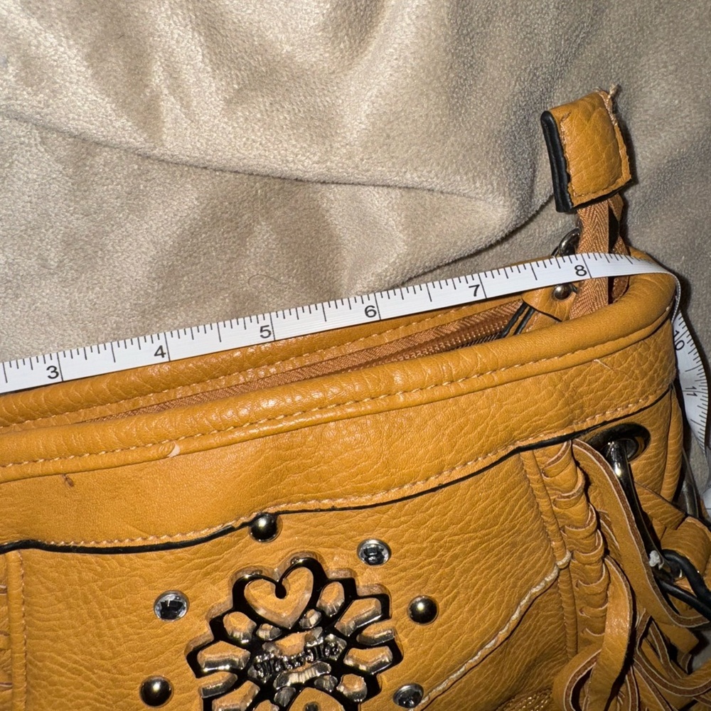 Miss Me brand leather bag